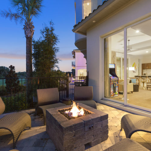 fireplace and outdoor social space at custom home in Orlando