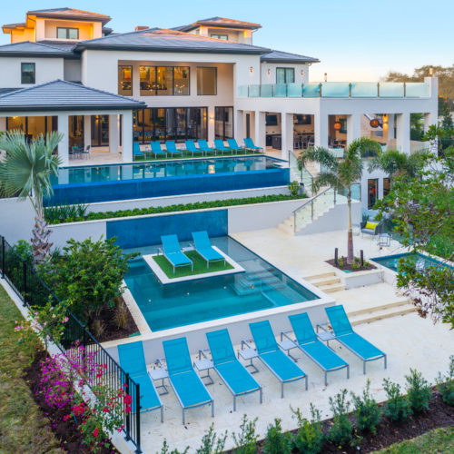 rear elevation of luxury home with pool by McNally Construction