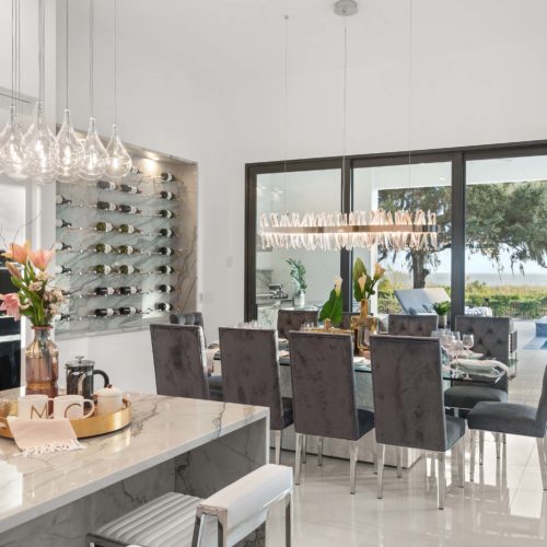 luxury dining room and kitchen island in custom home