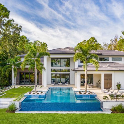 exterior elevation shot of luxury pool design at new custom Orlando home