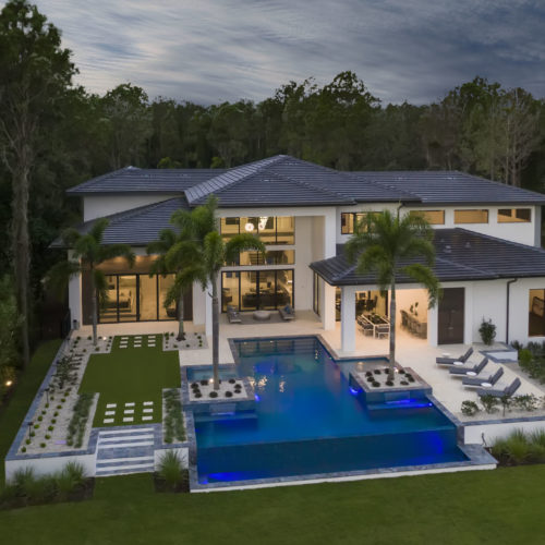 elevation of gorgeous custom luxury home with pool